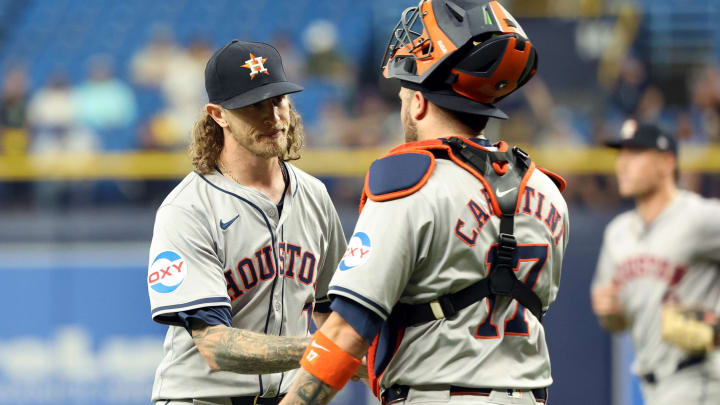 Houston Astros pitcher Josh Hader (71) and  catcher Victor Caratini (17) celebrate as they beat the Tampa Bay Rays on Wednesday at Tropicana Field.