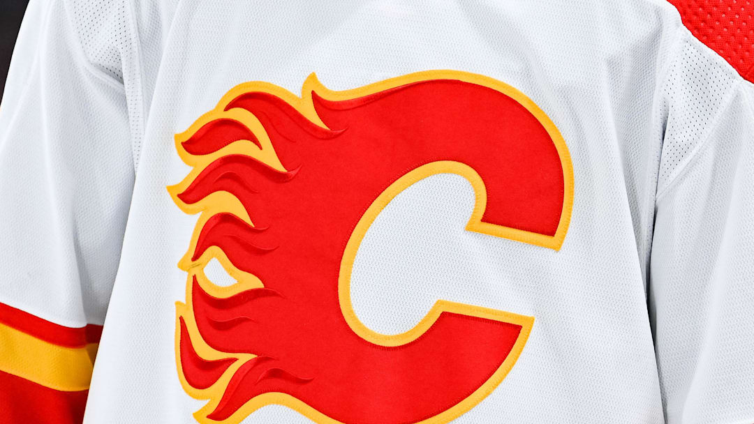 Dec 12, 2022; Montreal, Quebec, CAN; View of a Calgary Flames logo on a jersey worn by the member of the team during the second period at Bell Centre. Mandatory Credit: David Kirouac-Imagn Images