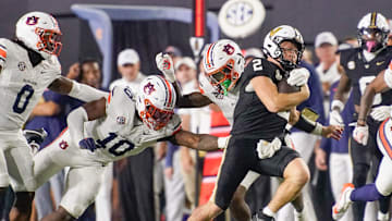 Auburn safety Kaleb Harris (8) gets ahold of Vanderbilt quarterback Diego Pavia (2) during the third quarter at FirstBank Stadium in Nashville, Tenn., Saturday, Nov. 8, 2025.