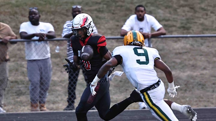 Mt. Healthy wide receiver Jai'mier Scott (0) catches a pass in front of Taft defender Adam Kirtley (9) during the Owls' 20-16 win Friday, Sept. 13, 2024. Mt. Healthy wide receiver Jai'mier Scott (0) catches a pass in front of Taft defender Adam Kirtley (9) during the Owls' 20-16 win Friday, Sept. 13, 2024.