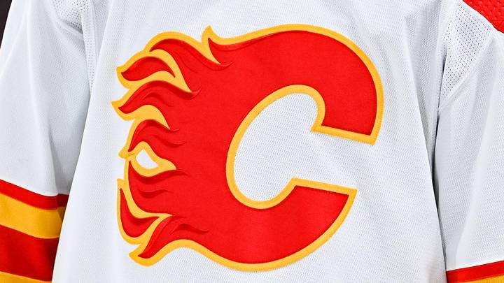 Dec 12, 2022; Montreal, Quebec, CAN; View of a Calgary Flames logo on a jersey worn by the member of the team during the second period at Bell Centre. Mandatory Credit: David Kirouac-Imagn Images