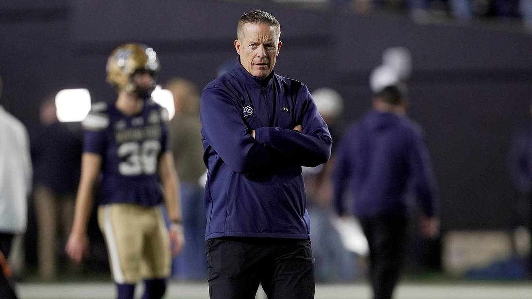 Montana State coach Brent Vigen watches his players warm up before playing Illinois State in the FCS National Championship game