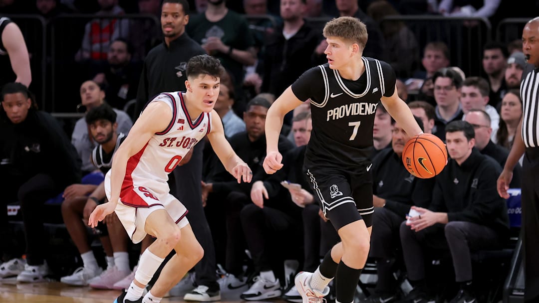 Mar 12, 2026; New York, NY, USA; Providence Friars guard Stefan Vaaks (7) controls the ball against St. John's Red Storm guard Dylan Darling (0) during the second half at Madison Square Garden. Mandatory Credit: Brad Penner-Imagn Images