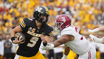 Oct 11, 2025; Columbia, Missouri, USA; Missouri Tigers quarterback Beau Pribula (9) runs the ball against Alabama Crimson Tide defensive lineman Keon Keeley (31) during the second half of the game at Faurot Field at Memorial Stadium. Mandatory Credit: Jay Biggerstaff-Imagn Images