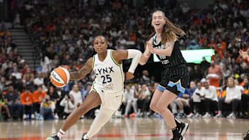 May 13, 2023; Toronto, Ontario, Canada; Minnesota Lynx guard Tiffany Mitchell (25) drives past Chicago Sky forward Anneli Maley (15) during the second half at Scotiabank Arena. Mandatory Credit: John E. Sokolowski-Imagn Images