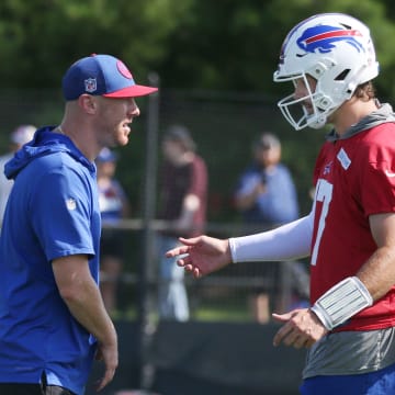 Bills quarterback Josh Allen talks with offensive coordinator Joe Brady during drills on day three of the Buffalo Bills training camp.