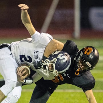 Midd South’s Lucas Donofrio gets tackled as he tries to make yardage on a broken play early in game. Middletown North Football defeats Middletown South in NJSIAA first round playoff game in Middletown, NJ on October 31, 2025.