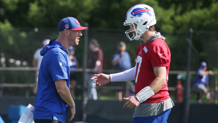 Bills quarterback Josh Allen talks with offensive coordinator Joe Brady during drills on day three of the Buffalo Bills training camp.