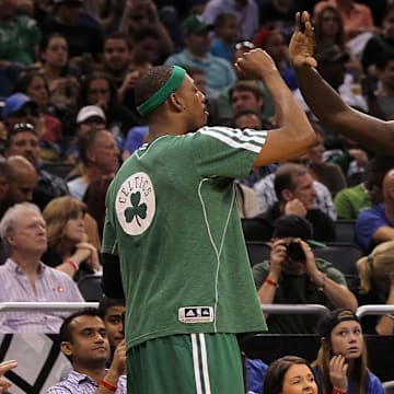 Apr 13, 2013; Orlando, FL, USA; Boston Celtics small forward Paul Pierce (34) and center Kevin Garnett (5) congratulate each other during the second half against the Orlando Magic at the Amway Center. Boston Celtics won 120-88. Mandatory Credit: Kim Klement-Imagn Images