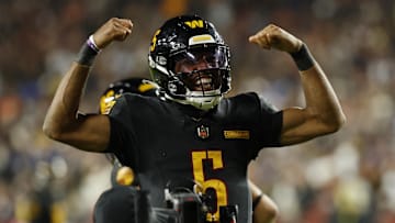 Washington Commanders quarterback Jayden Daniels reacts after a play against the Chicago Bears during the second half of a Monday Night Football game at Northwest Stadium on Oct. 13. Through September, Daniels' football cards have generated more than $25 million in eBay sales in 2025.