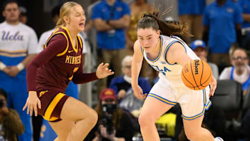UCLA guard Kiki Rice steals the ball away from Minnesota guard McKenna Johnson (7) during the fourth quarter at Pauley Pavilion presented by Wescom in Los Angeles on Feb. 2, 2025.