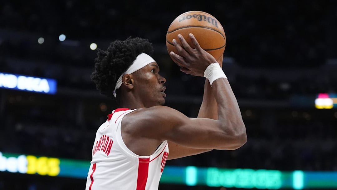 Mar 11, 2026; Denver, Colorado, USA; Houston Rockets guard Amen Thompson (1) lines up a three point basket in the first quarter against the Denver Nuggets at Ball Arena. Mandatory Credit: Ron Chenoy-Imagn Images