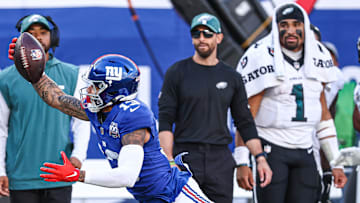 Oct 20, 2024; East Rutherford, New Jersey, USA; New York Giants wide receiver Jalin Hyatt (13) attempts to catch a pass in front of Philadelphia Eagles safety Tristin McCollum (36) during the second half at MetLife Stadium. Mandatory Credit: Vincent Carchietta-Imagn Images