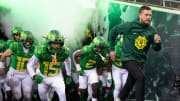 Oregon football coach Dan Lanning leads his team onto the field before the game against Oregon State at Autzen Stadium Friday, Nov. 24, 2023.