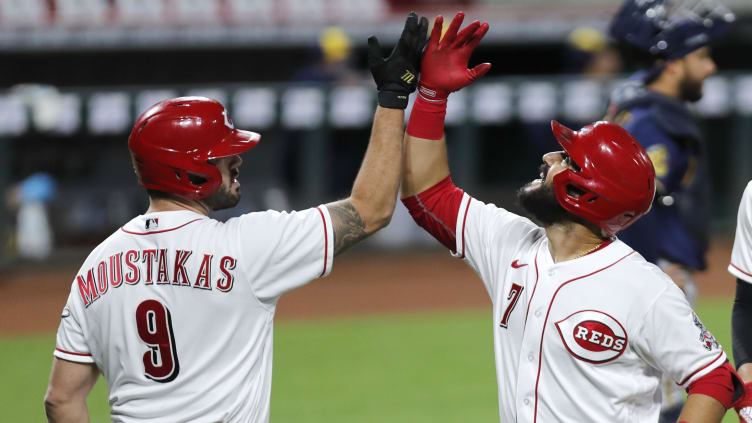 Cincinnati Reds third baseman Eugenio Suarez (7) reacts with Mike Moustakas.