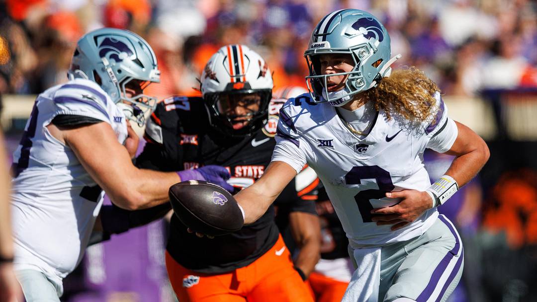 Nov 15, 2025; Stillwater, Oklahoma, USA; Kansas State Wildcats quarterback Avery Johnson (2) hands off the ball during the second half against the Oklahoma State Cowboys at Boone Pickens Stadium. 