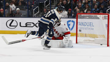 Dec 31, 2024; Columbus, Ohio, USA; Columbus Blue Jackets center Kent Johnson (91) scores a goal against the Carolina Hurricanes during the shootout at Nationwide Arena. Mandatory Credit: Russell LaBounty-Imagn Images
