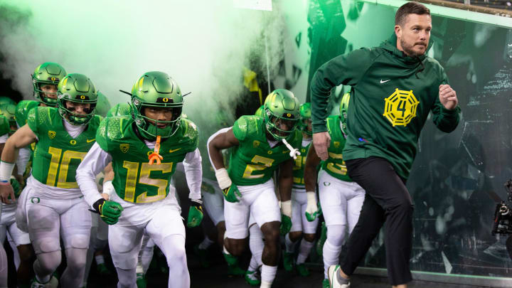 Oregon football coach Dan Lanning leads his team onto the field before the game against Oregon State at Autzen Stadium Friday, Nov. 24, 2023.