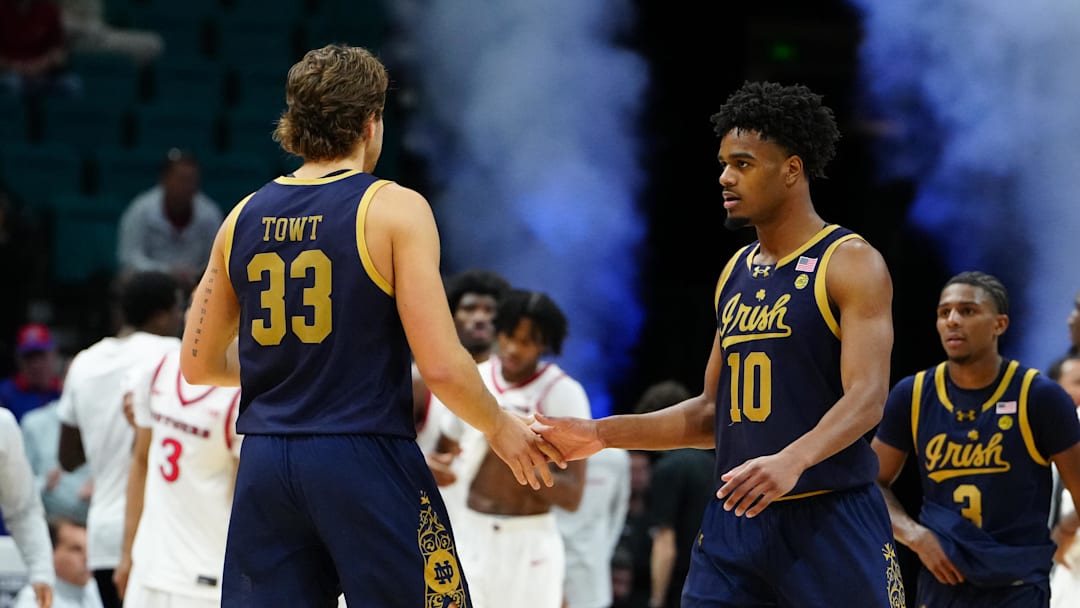 Nov 25, 2025; Las Vegas, Nevada, USA; Notre Dame Fighting Irish forward Carson Towt (33) and guard Jalen Haralson (10) celebrate after a 2025 Players Era Festival group play game against the Rutgers Scarlet Knights at MGM Grand Garden Arena. Mandatory Credit: Stephen R. Sylvanie-Imagn Images