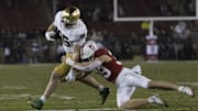 Nov 29, 2025; Stanford, California, USA;  Stanford Cardinal safety Charlie Eckhardt (39) attempts to tackle Notre Dame Fighting Irish tight end Jack Larsen (85) during the fourth quarter at Stanford Stadium. Mandatory Credit: Stan Szeto-Imagn Images