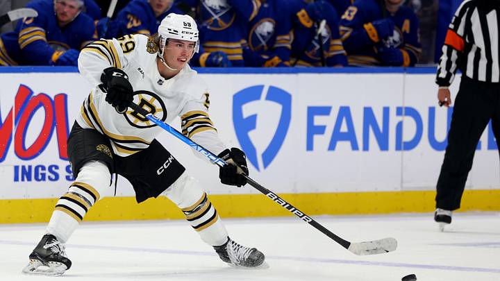 Sep 26, 2023; Buffalo, New York, USA; Boston Bruins defenseman Frederic Brunet (59) makes a pass during the third period against the Buffalo Sabres at KeyBank Center. Sep 26, 2023; Buffalo, New York, USA; Boston Bruins defenseman Frederic Brunet (59) makes a pass during the third period against the Buffalo Sabres at KeyBank Center.