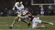Nov 29, 2025; Stanford, California, USA;  Stanford Cardinal safety Charlie Eckhardt (39) attempts to tackle Notre Dame Fighting Irish tight end Jack Larsen (85) during the fourth quarter at Stanford Stadium. Mandatory Credit: Stan Szeto-Imagn Images