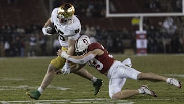 Nov 29, 2025; Stanford, California, USA;  Stanford Cardinal safety Charlie Eckhardt (39) attempts to tackle Notre Dame Fighting Irish tight end Jack Larsen (85) during the fourth quarter at Stanford Stadium. Mandatory Credit: Stan Szeto-Imagn Images