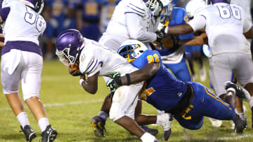 Gainesville High School Joh Cooper (9) is tackled by Newberry High School's Jarquez Carter (92) as he runs the ball, during a spring football game at NHS in Newberry FL. May 20, 2022. [Brad McClenny/The Gainesville Sun]

Flgai 052022 Ghsvnewberryspringfb 09