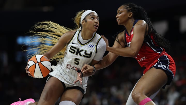 Jul 29, 2025; Washington, District of Columbia, USA; Chicago Sky forward Angel Reese (5) drives to the basket as Washington Mystics forward Kiki Iriafen (44) defends in the first half at CareFirst Arena. Mandatory Credit: Geoff Burke-Imagn Images