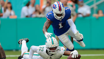 Nov 9, 2025; Miami Gardens, Florida, USA; Miami Dolphins cornerback JuJu Brents (32) recovers a fumble against Buffalo Bills wide receiver Curtis Samuel (1).