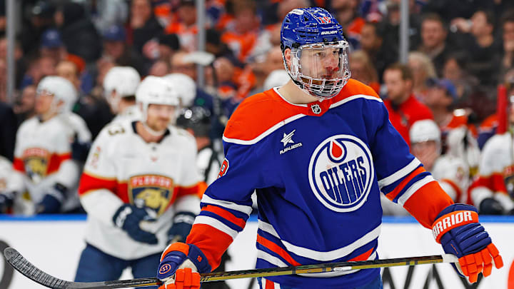 Dec 16, 2024; Edmonton, Alberta, CAN; Edmonton Oilers forward Zach Hyman (18) wears a full visor after being hit in the face by a deflected shot and breaking his nose against the Florida Panthers at Rogers Place. Mandatory Credit: Perry Nelson-Imagn Images