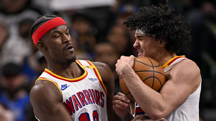 Feb 12, 2025; Dallas, Texas, USA; Golden State Warriors forward Jimmy Butler (10) and forward Gui Santos (15) in action during the game between the Dallas Mavericks and the Golden State Warriors at the American Airlines Center. Mandatory Credit: Jerome Miron-Imagn Images