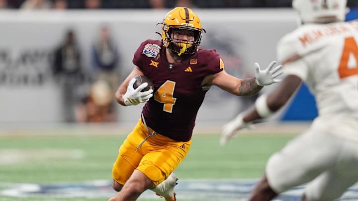 Jan 1, 2025; Atlanta, GA, USA; Arizona State Sun Devils running back Cam Skattebo (4) runs with the ball against the Texas Longhorns during the second half of the Peach Bowl at Mercedes-Benz Stadium. Mandatory Credit: Dale Zanine-Imagn Images