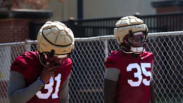 FSU football players walk into the first spring practice of the spring season on Wednesday, March 19, 2025