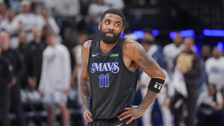 May 24, 2024; Minneapolis, Minnesota, USA; Dallas Mavericks guard Kyrie Irving (11) reacts in the fourth quarter against the Minnesota Timberwolves in game two of the western conference finals for the 2024 NBA playoffs at Target Center. Mandatory Credit: Brad Rempel-USA TODAY Sports