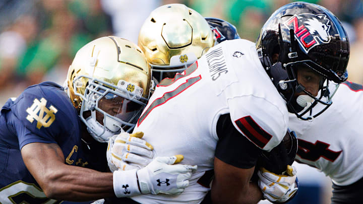 Northern Illinois running back Gavin Williams (21) attempts to break free from Notre Dame's defense during a NCAA college football game between Notre Dame and Northern Illinois at Notre Dame Stadium on Saturday, Sept. 7, 2024, in South Bend.