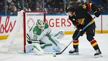 Nov 20, 2025; Vancouver, British Columbia, CAN; Dallas Stars goalie Jake Oettinger (29) makes a save on Vancouver Canucks forward Kiefer Sherwood (44) in the second period at Rogers Arena. Mandatory Credit: Bob Frid-Imagn Images