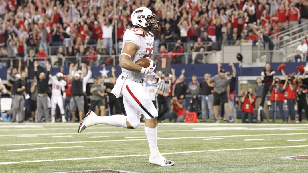 Nov 16, 2013; Arlington, TX, USA;  Texas Tech Red Raiders tight end Jace Amaro (22) scores on a touchdown pass in the first quarter against the Baylor Bears at AT&T Stadium. Mandatory Credit: Tim Heitman-USA TODAY Sports