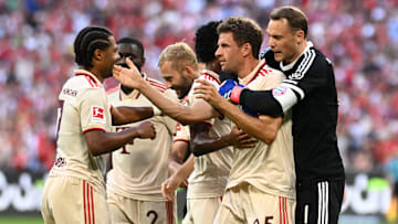 Bayern Munich players celebrating after Thomas Muller scored against Freiburg.