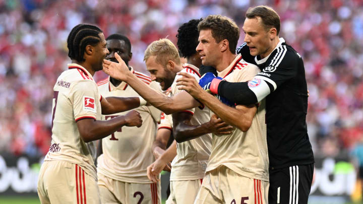 Bayern Munich players celebrating after Thomas Muller scored against Freiburg.