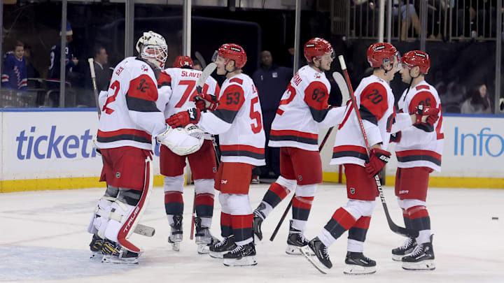Feb 5, 2026; New York, New York, USA; Carolina Hurricanes goaltender Brandon Bussi (32) celebrates with teammates after defeating the New York Rangers at Madison Square Garden. Mandatory Credit: Brad Penner-Imagn Images