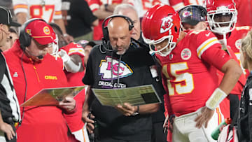 Oct 7, 2024; Kansas City, Missouri, USA; Kansas City Chiefs quarterback Patrick Mahomes (15) looks at plays with offensive coordinator Matt Nagy, center, and head coach Andy Reid against the New Orleans Saints during the first half at GEHA Field at Arrowhead Stadium. Mandatory Credit: Denny Medley-Imagn Images