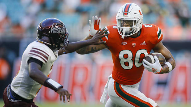 Miami Hurricanes tight end Elijah Arroyo (80) runs with the football