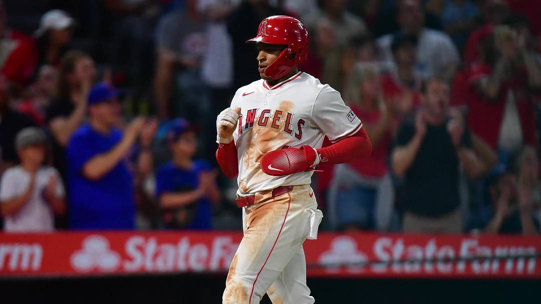Sep 26, 2025; Anaheim, California, USA; Los Angeles Angels second baseman Christian Moore (4) scores a run against the Houston Astros during the fifth inning at Angel Stadium. Mandatory Credit: Gary A. Vasquez-Imagn Images