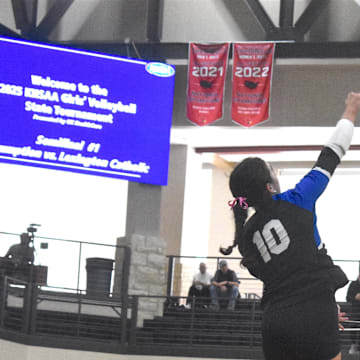 Lexington Catholic High School senior Payton Avilez hits the ball Nov. 8, 2025 in a state semifinal volleyball match against Assumption High School.