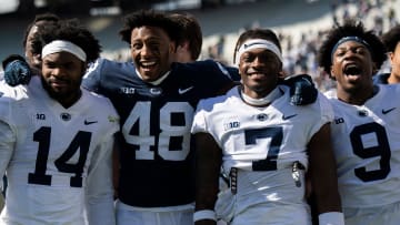 Penn State defensive players Tyrece Mills (14), Kaveion Keys (48), Zion Tracy (7) and King Mack (9)