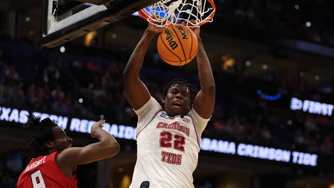 Mar 22, 2026; Tampa, FL, USA; Alabama Crimson Tide forward Aiden Sherrell (22) dunks past Texas Tech Red Raiders forward Luke Bamgboye (9) in the first half during a second round game of the men's 2026 NCAA Tournament at Benchmark International Arena. Mandatory Credit: Matt Pendleton-Imagn Images