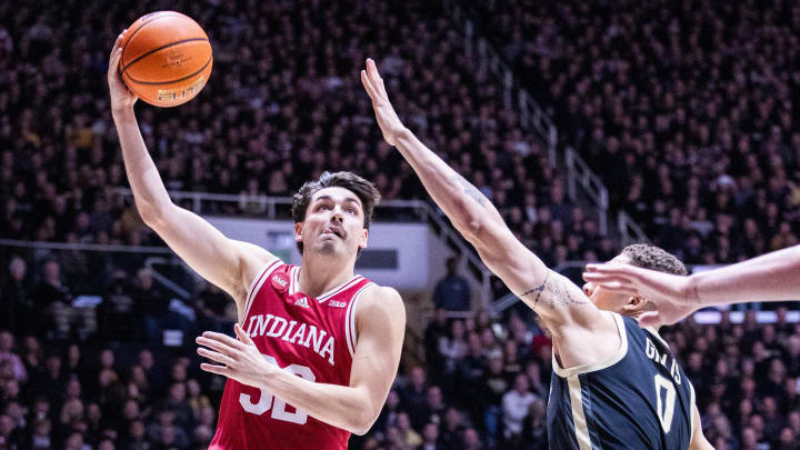 Indiana Hoosiers guard Trey Galloway (32) shoots over Purdue Boilermakers forward Mason Gillis (0) at Mackey Arena. 