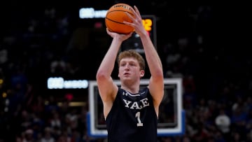 Dec 22, 2023; Lawrence, Kansas, USA; Yale Bulldogs forward Danny Wolf (1) shoots a three point shot against Kansas.