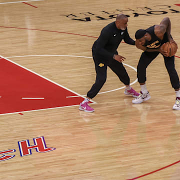 Nov 8, 2023; Houston, Texas, USA;  Los Angeles Lakers forward LeBron James (23) practices with assistant coach Phil Handy before playing against the Houston Rockets at Toyota Center. Mandatory Credit: Thomas Shea-Imagn Images